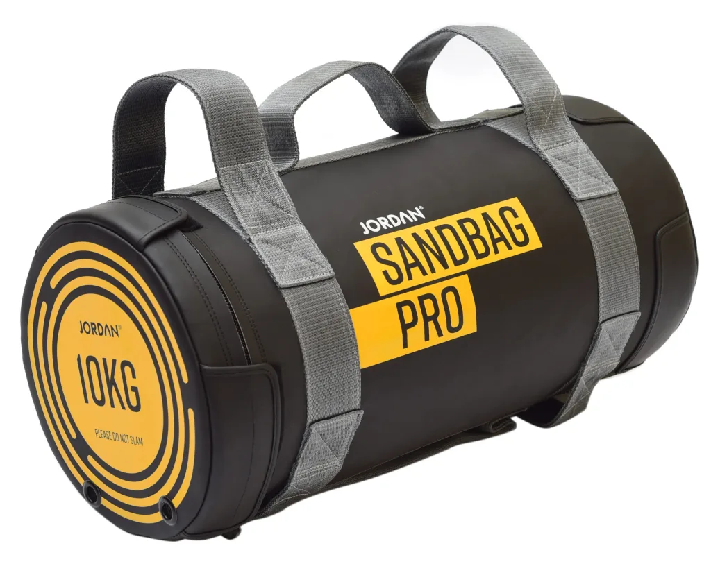 Black sandbag with grey handles and yellow label reading 'SANDBAG PRO' and end cap marked '10KG PLEASE DO NOT SLAM'.