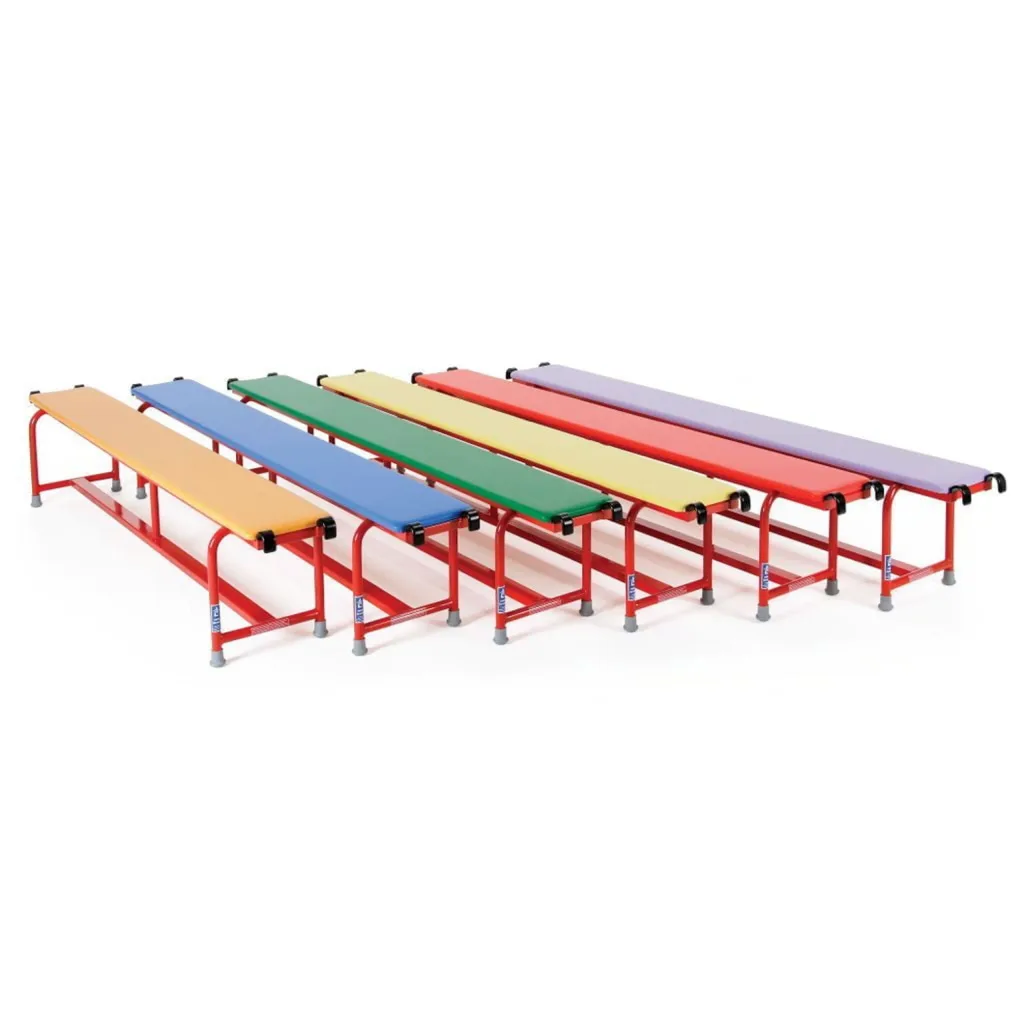 Six padded balance benches with red powder-coated steel frames and vinyl tops in orange, blue, green, yellow, red and purple, each with metal hooks at both ends and rubber feet.