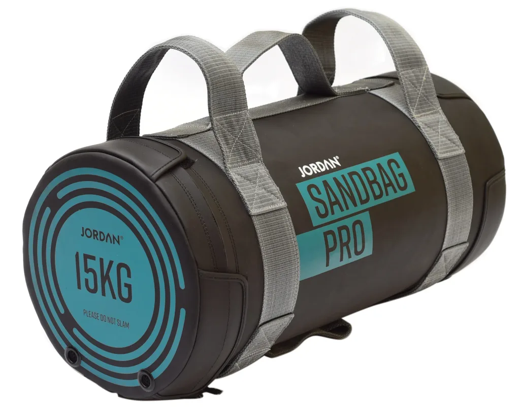 Black cylindrical sandbag with gray webbed handles and teal end label reading 15KG, please do not slam and sandbag pro.
