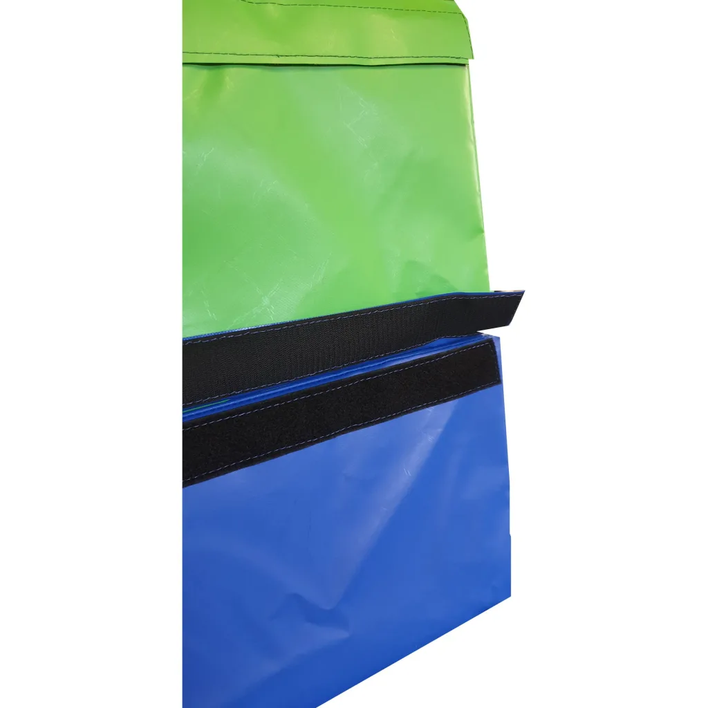 Green and blue PVC-covered foam vaulting box sections fastened together with black hook-and-loop straps, visible stitching and a flap edge.