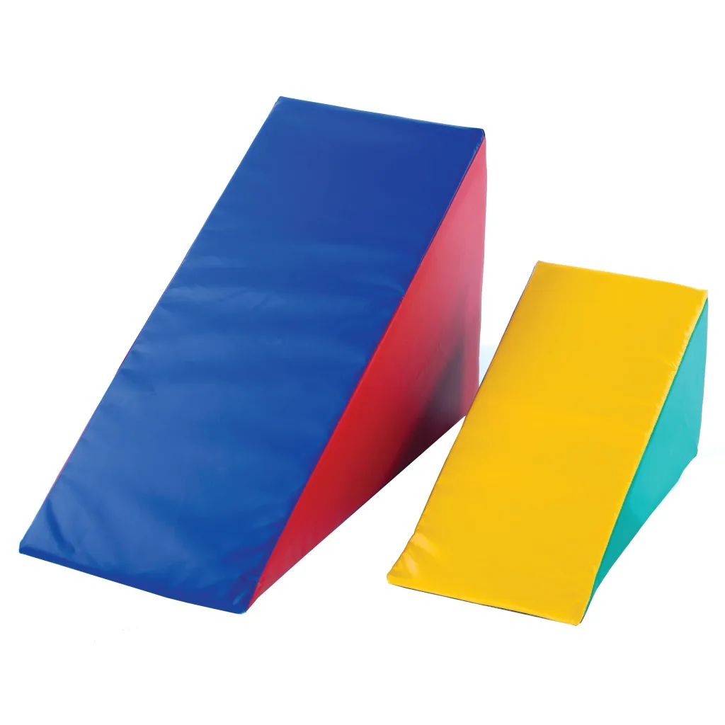 Two soft play foam wedges, one large with a blue top and red side and a smaller one with a yellow top and turquoise side on a white background.