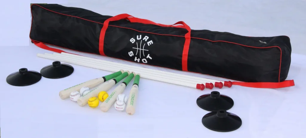 Black equipment bag labeled Sure Shot with red straps, white poles, four black rubber post bases, four wooden bats and white and yellow balls.