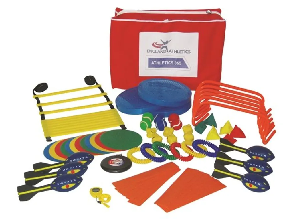 Red carry bag labeled ENGLAND ATHLETICS ATHLETICS 365 with scattered colorful training equipment including discs, mini hurdles, cones, rings and medicine balls.