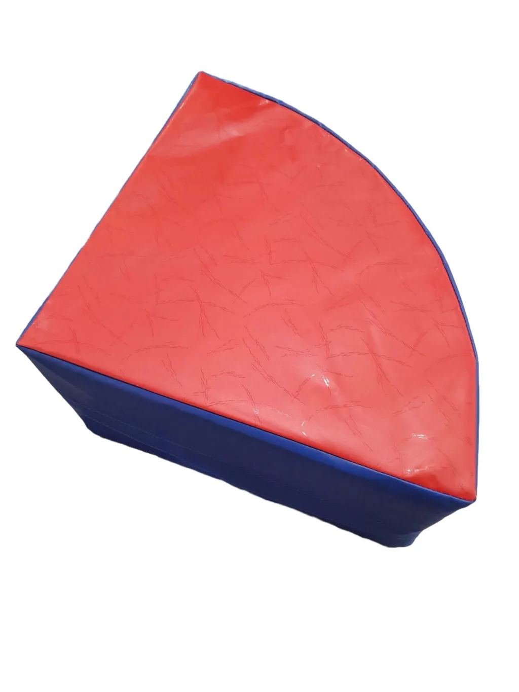 Childrens wedge pouffe with red PVC top, blue PVC sides, and foam filled PVC cover.