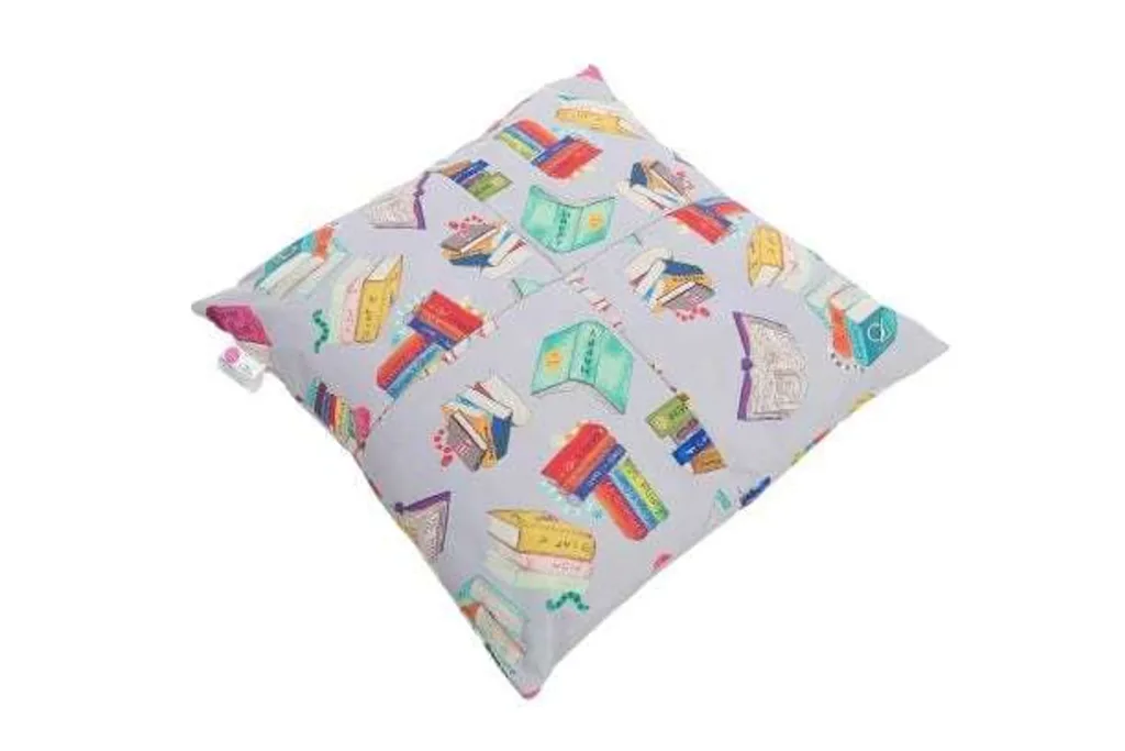 Giant child floor cushion with 100% wipe-clean cover printed with colorful book illustrations and a removable liner.