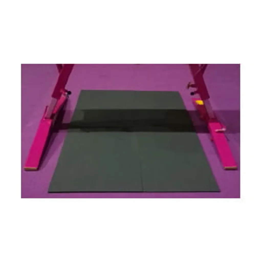 Stack of steel plates centered on a purple floor between two pink pommel horse supports.