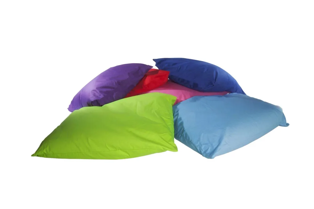 Large indoor/outdoor polyester floor cushions piled together in lime, turquoise, royal blue, purple, pink and red.