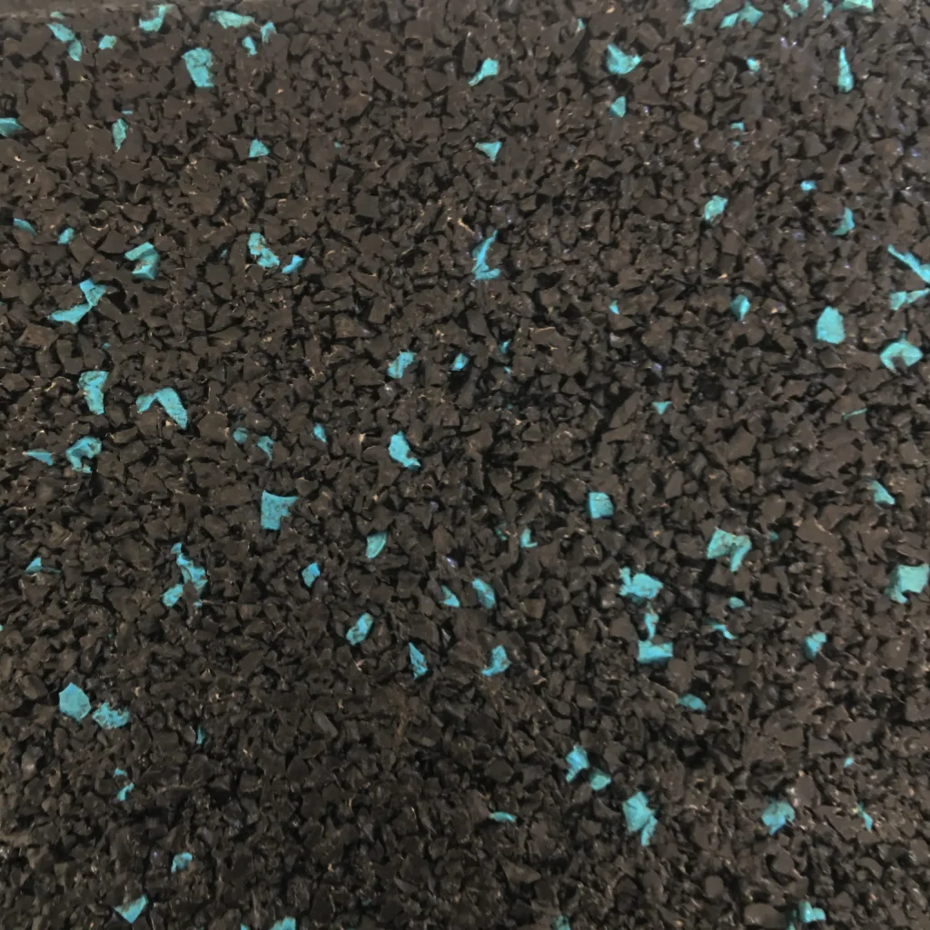 Close-up of black gym flooring with scattered blue flecks.