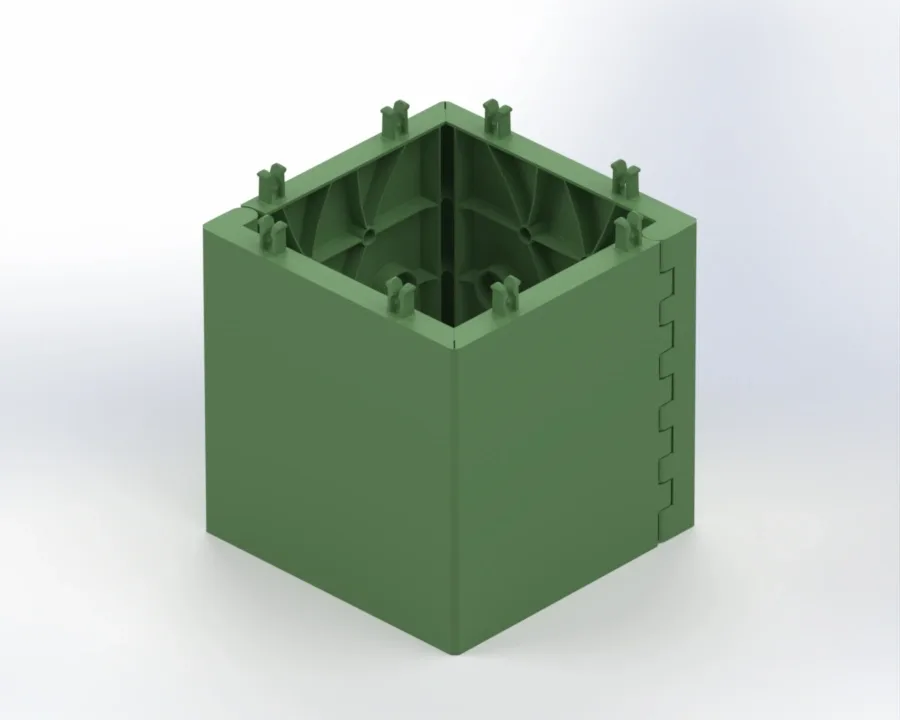 Green hollow square training block with interlocking side tabs and internal ribbed supports.