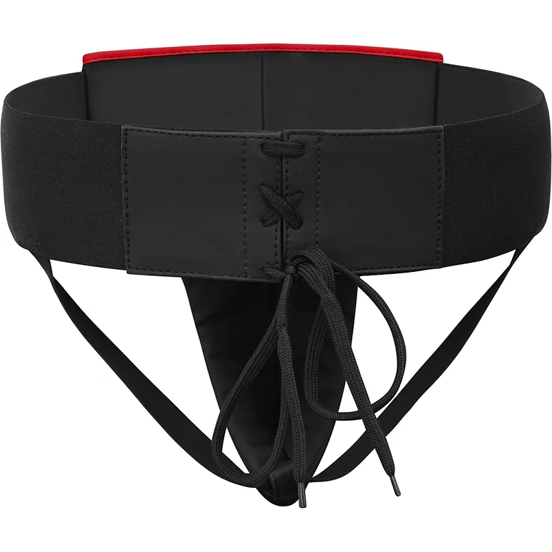 Black groin guard with wide elastic waistband, lace-up front panel, triangular protective cup and two leg straps, with red trim.