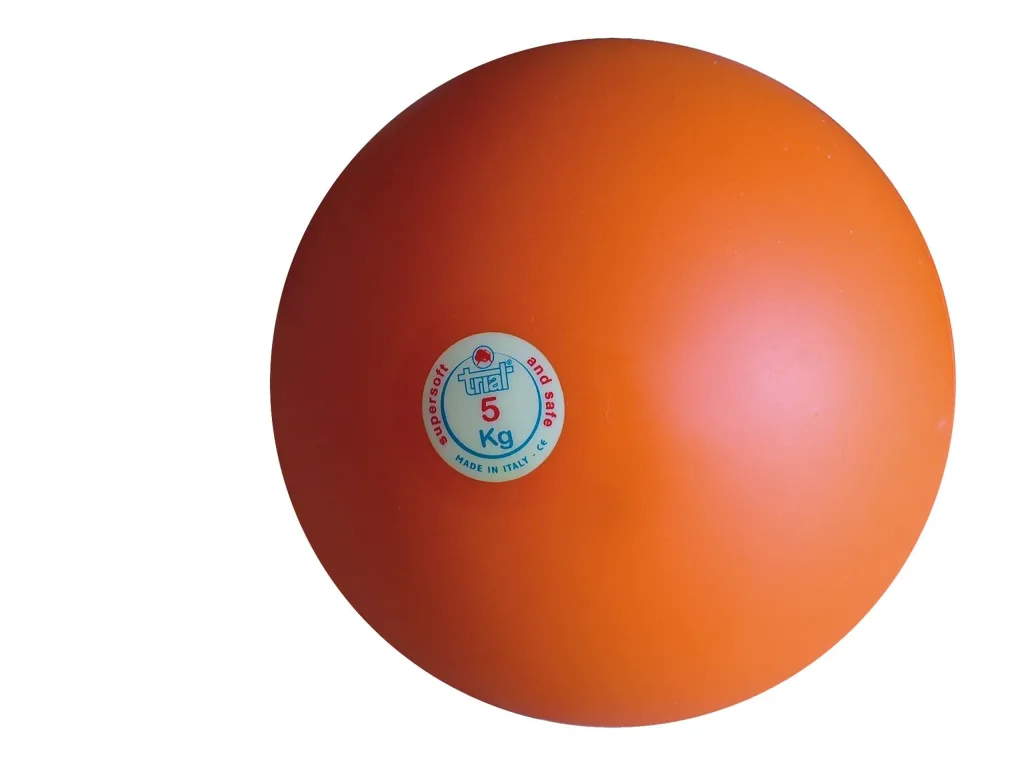 Orange indoor shot put with a white label reading 5 Kg, supersoft and safe, MADE IN ITALY - CE.