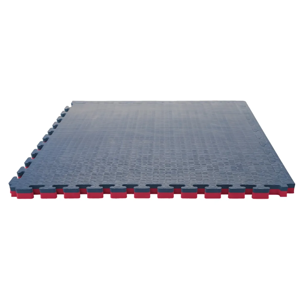 Blue/red tatami-finish EVA foam interlocking mat panel with visible jigsaw edges and red underside showing reversible colours.