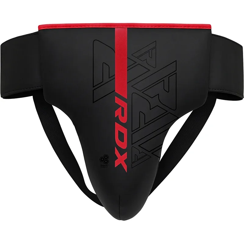 Black groin guard with a red vertical stripe and RDX text, contoured cup and black elastic straps.