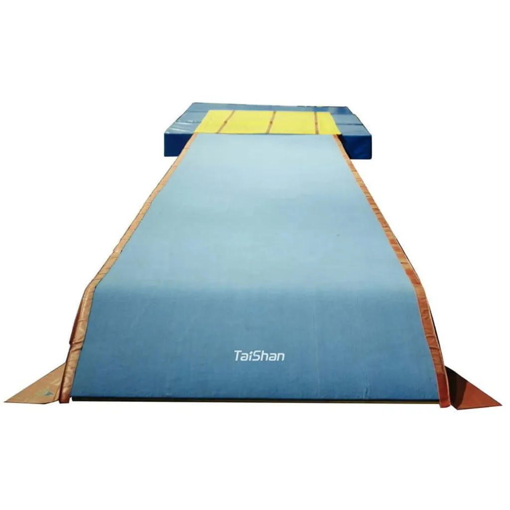 Light blue tumble track with TaiShan printed near the front and yellow landing mats at the far end.