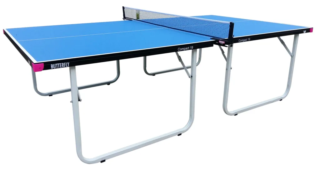 Compact 19 table tennis table with blue playing top, black trim, magenta corner pieces, light silver folding legs and attached net.