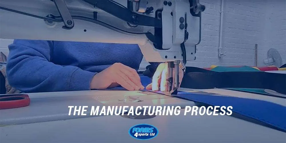 Hands guide fabric under an industrial sewing machine, with the text THE MANUFACTURING PROCESS across the foreground.