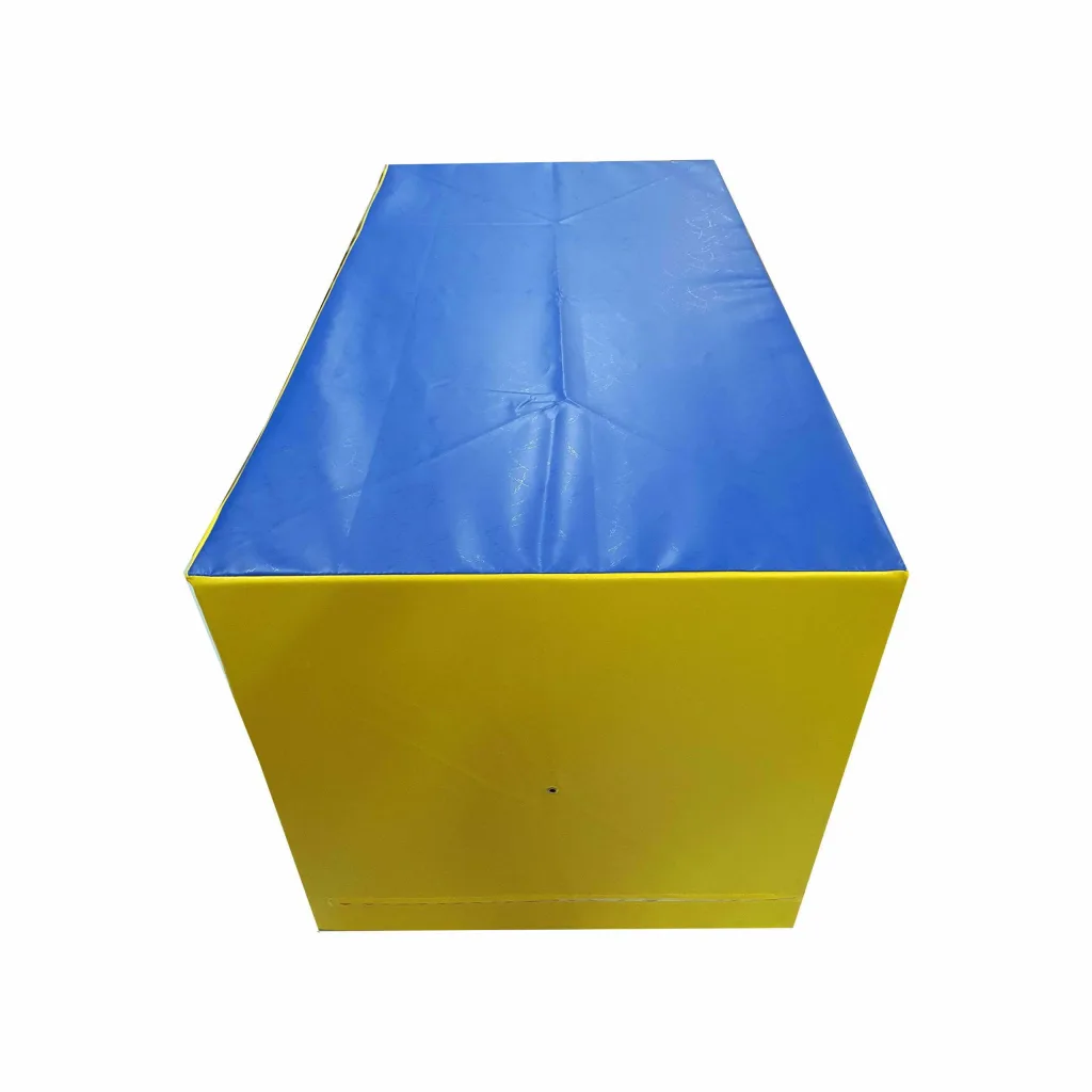 Large spotting block with blue top and yellow end, rectangular foam block with visible seams and PVC cover.