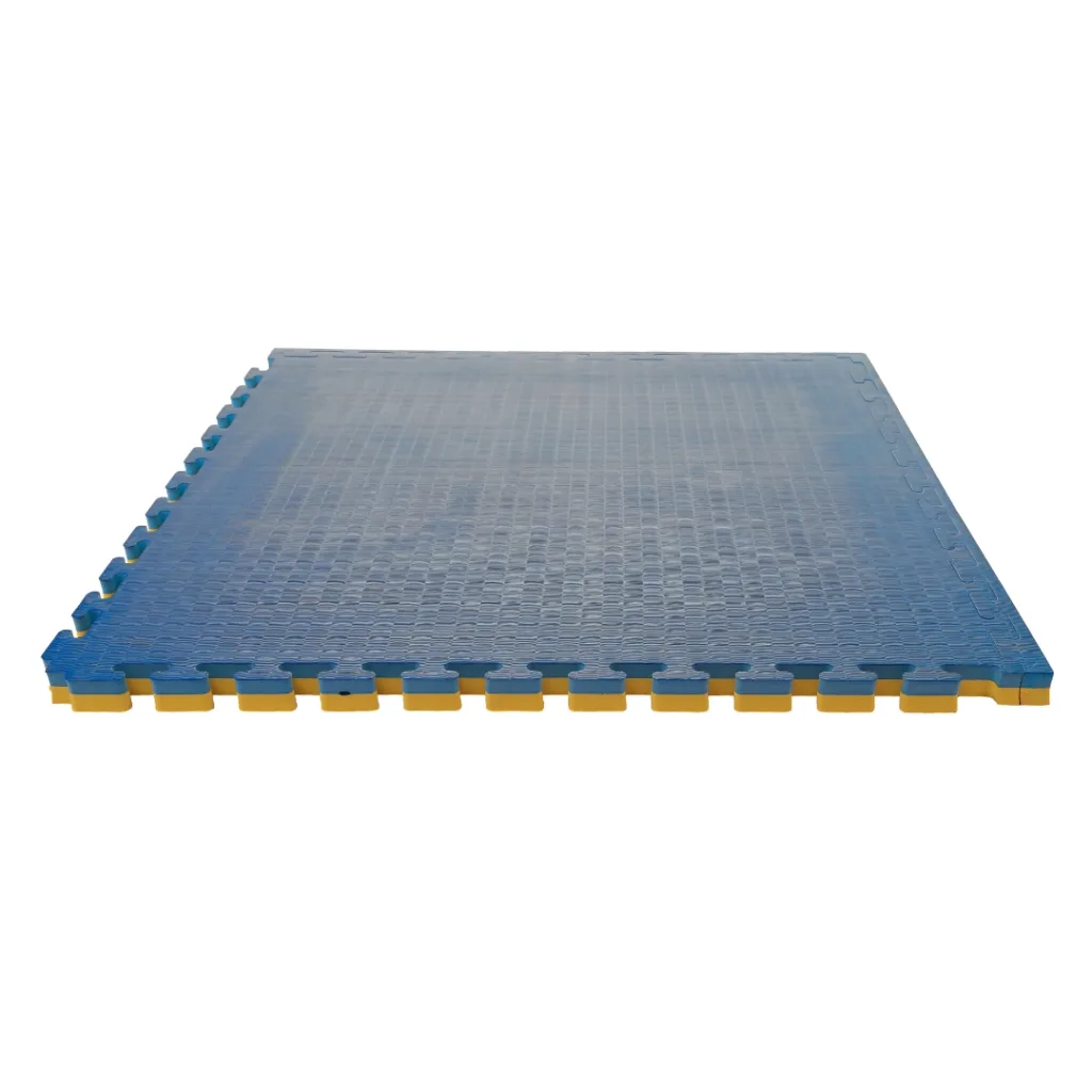 Blue and yellow reversible interlocking jigsaw EVA foam mat with tatami finish and visible puzzle edges.