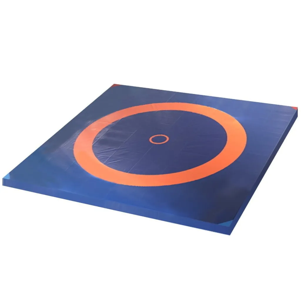 Blue wrestling mat with a large orange outer ring and small orange inner circle.