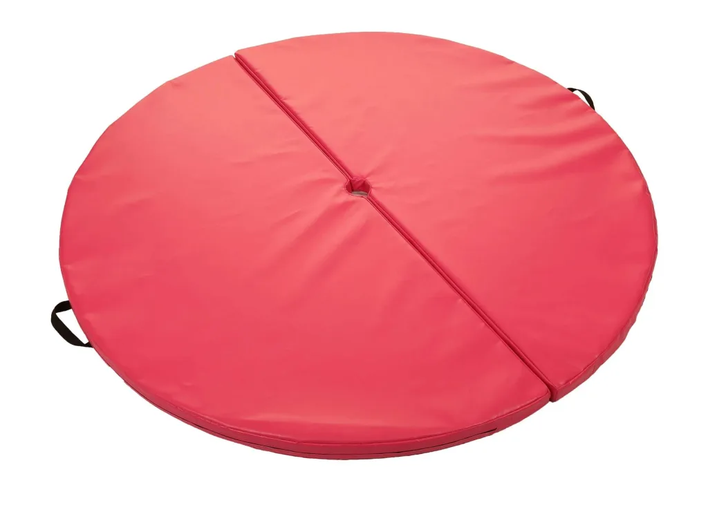Round heavy-duty PVC pole mat in two hinged pieces with a central hole, visible seam and carry handles.