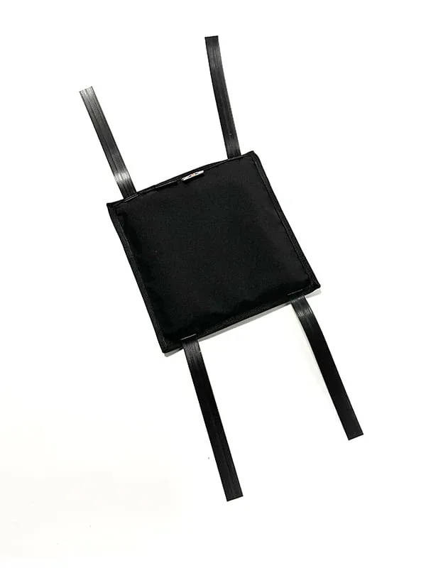 Black square training pad with four long straps extending from its sides on a white background.
