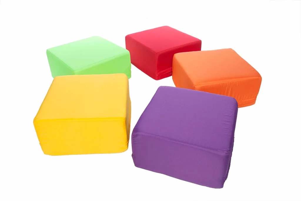Five square foam seating pods in purple, yellow, green, red and orange with removable polyester covers for indoor/outdoor use arranged on a white background.