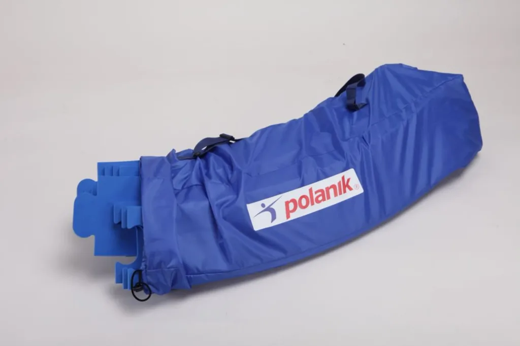 Blue carry bag labeled polanik holding foam throwing circle segments with several segment ends protruding.