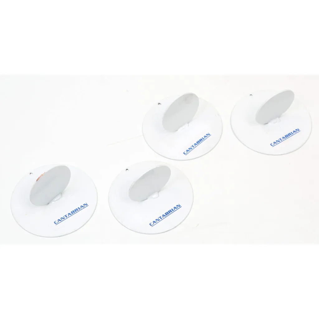 Four white metal runway markers made from welded round sheets with upright oval fins, each labeled "CANTABRIAN".