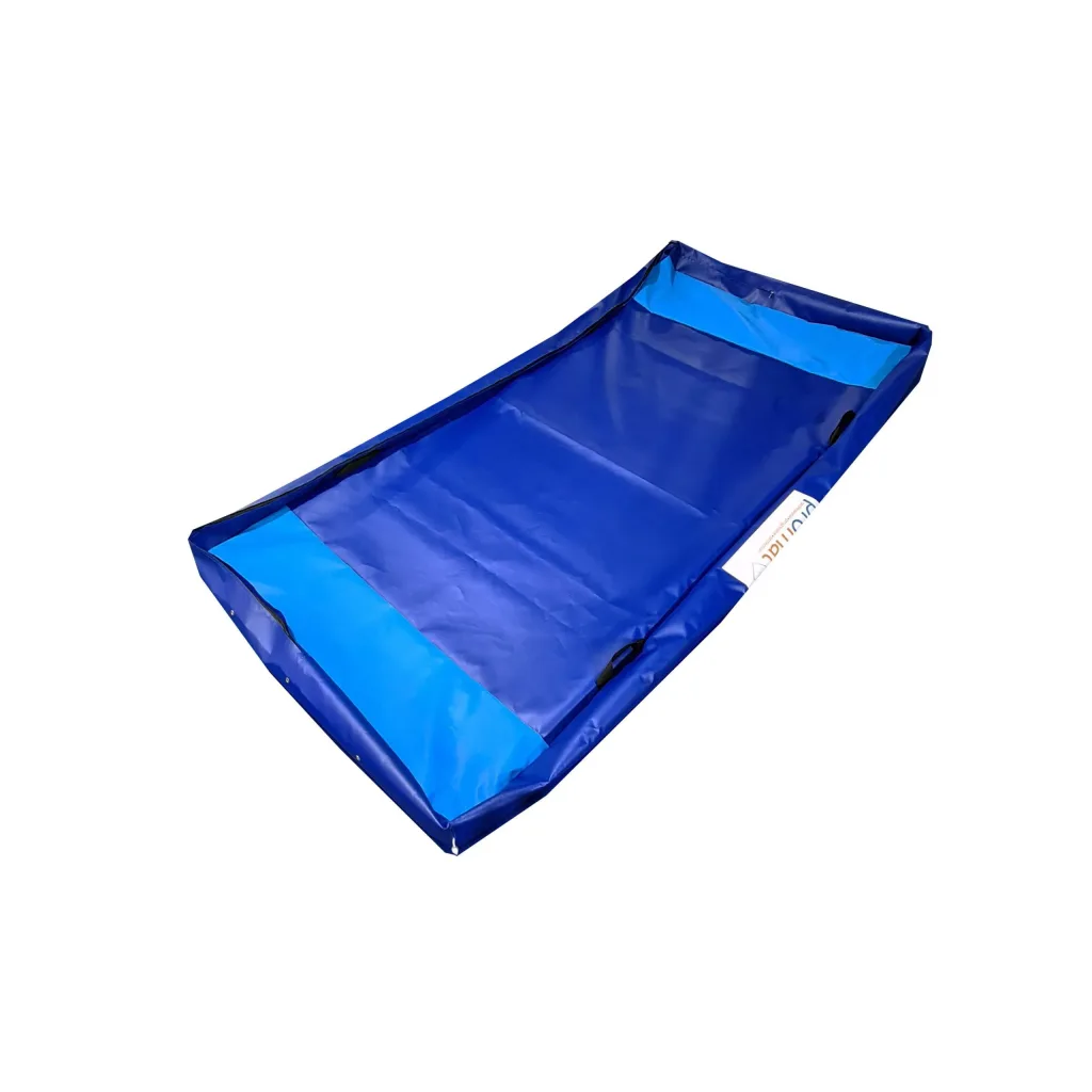 Blue flame-retardant nylon-reinforced PVC crash mat cover with lighter blue end panels, raised edges, carry handles and a white side label.