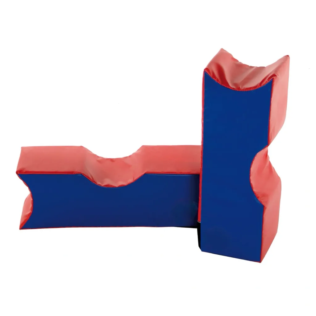 Red and blue soft-play foam blocks with curved notches arranged in an L-shaped configuration.