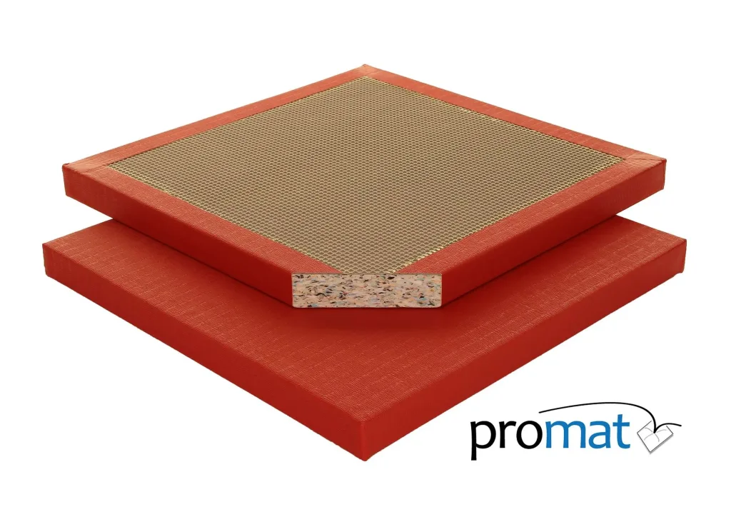 Two red judo mats stacked, top mat with beige tatami embossed center and a cutaway edge showing multicolored foam core, and promat logo.