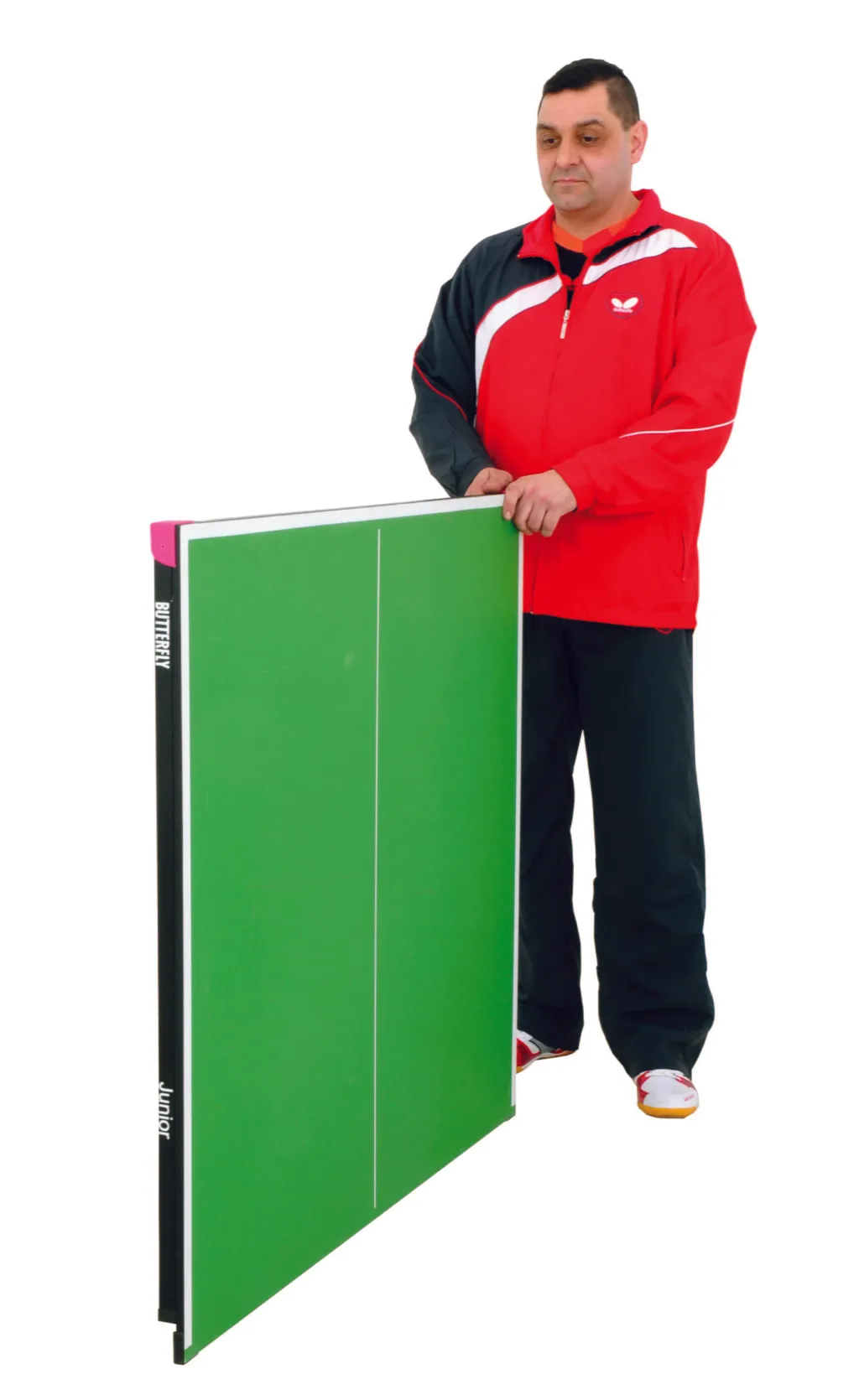 Folded junior table half held upright with green playing top, magenta corner piece, steel frame and light silver legs, showing text 'BUTTERFLY' and 'Junior'.