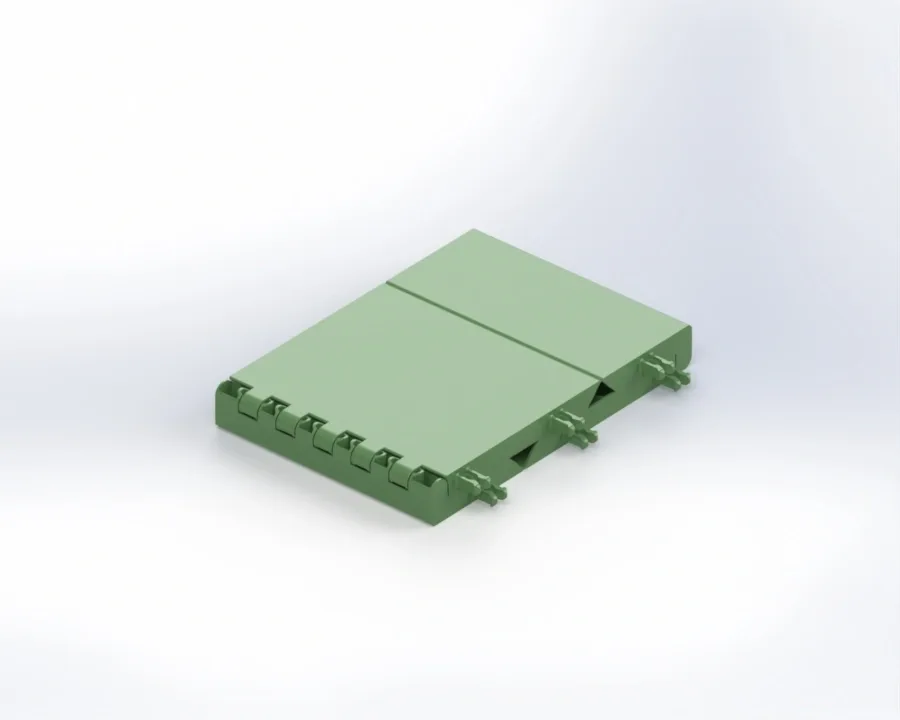 Green modular training block with two hinged top panels and interlocking tabs along one side on a white background.