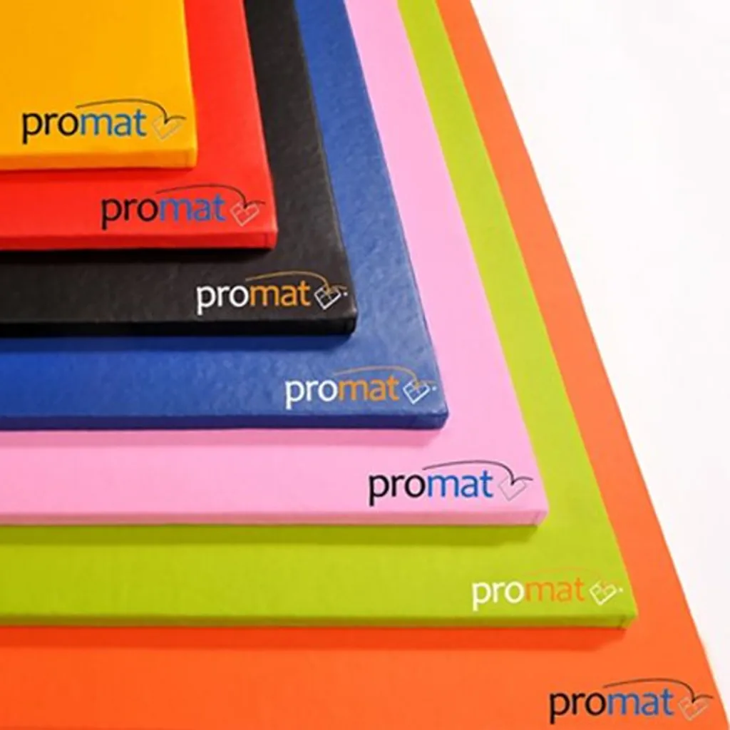 Stacked colorful PVC gym mats with the text "promat" visible on several edges.