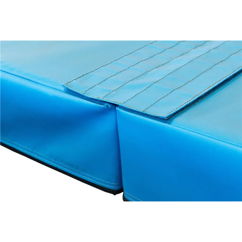 Two rectangular competition landing mat sections joined edge-to-edge, with a quilted top flap, stitched vinyl cover and visible zipper seam.
