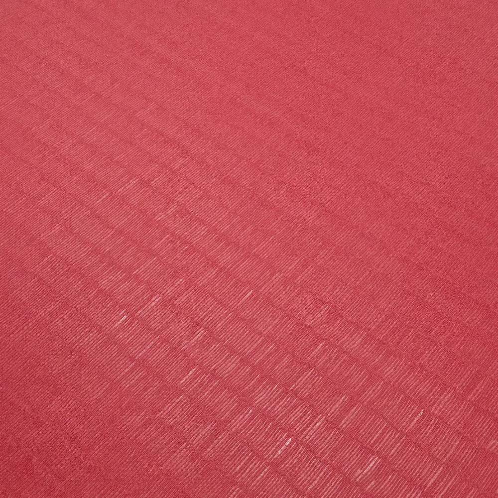 Red tatami-finish martial arts mat showing diagonal waffle anti-slip texture across the surface.