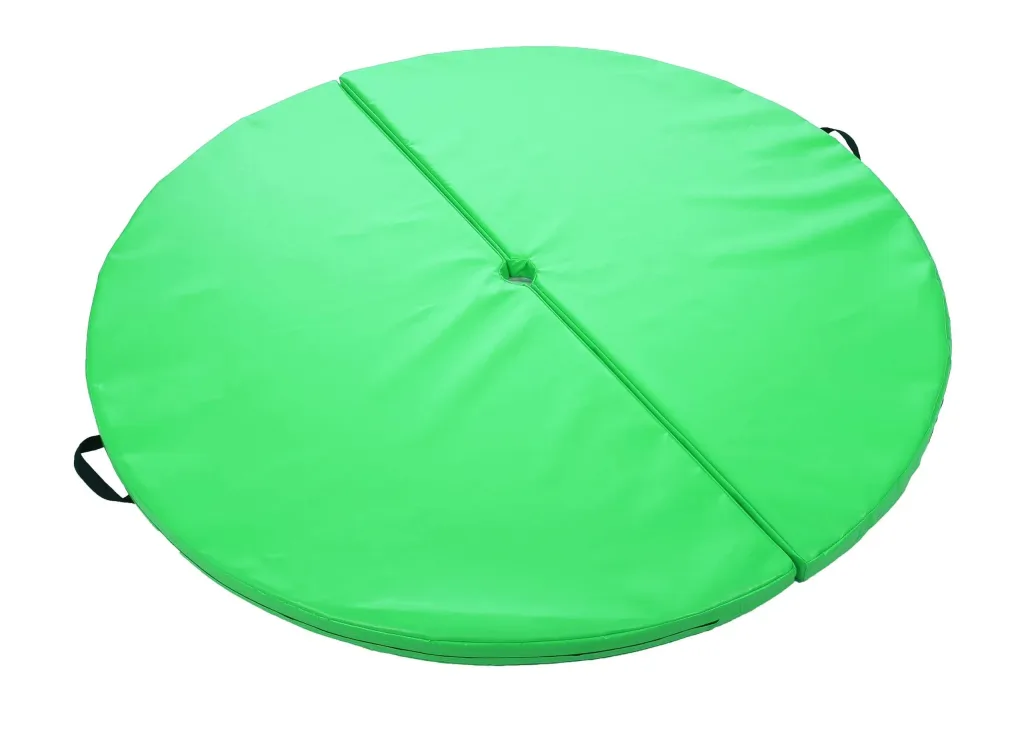 Round green two-piece pole mat in heavy-duty PVC with a central hole, fixed carry handles, and hook-and-loop fastening.