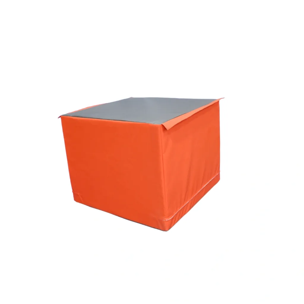 Orange foam cuboid with a grey top, part of the five-piece gymnastics play set.