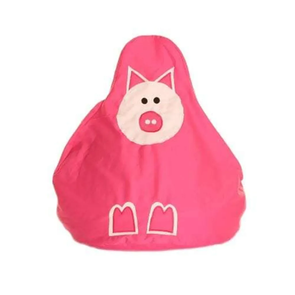 Pink bean bag shaped like a pig with a white circular face, pink snout with two dots, black eyes, triangular ears and white hoof outlines.