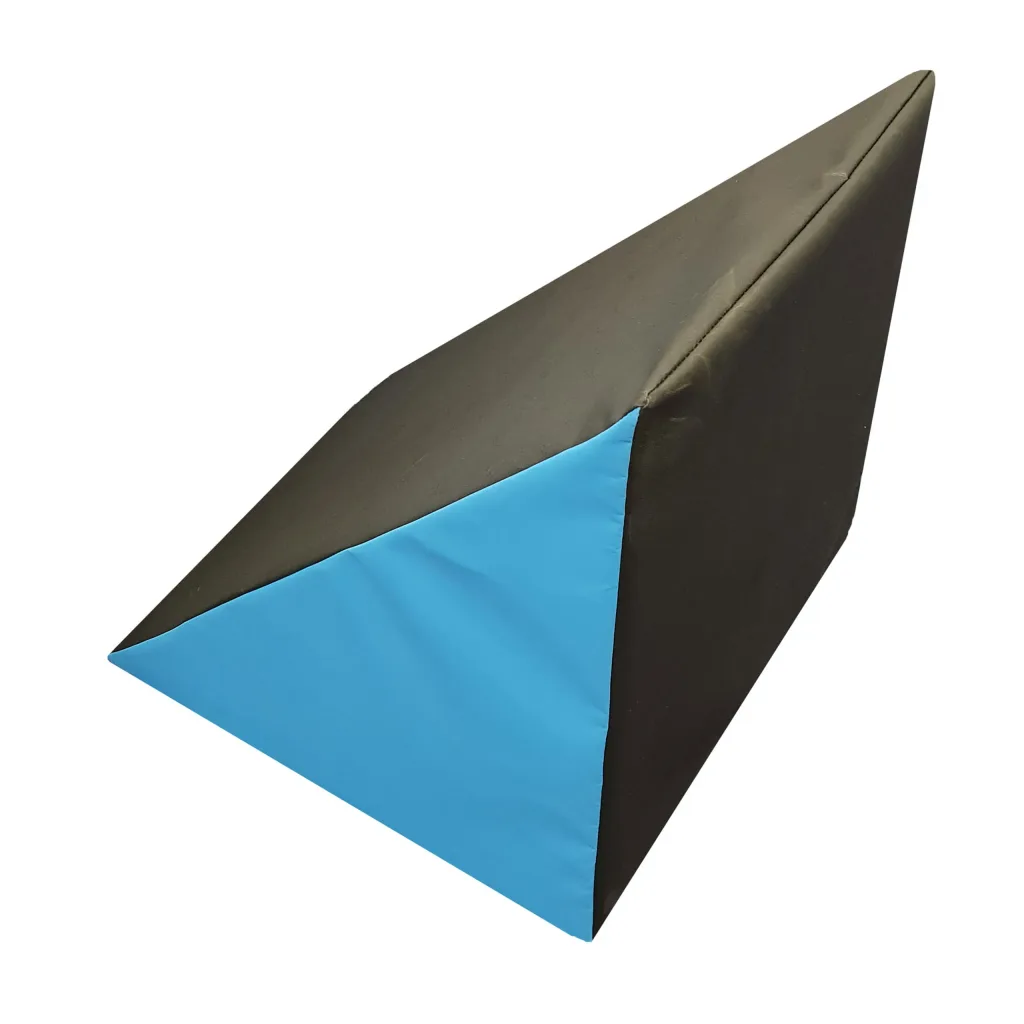 Black wedge-shaped foam step features a blue triangular end and a heavy-duty flame-retardant PVC cover.