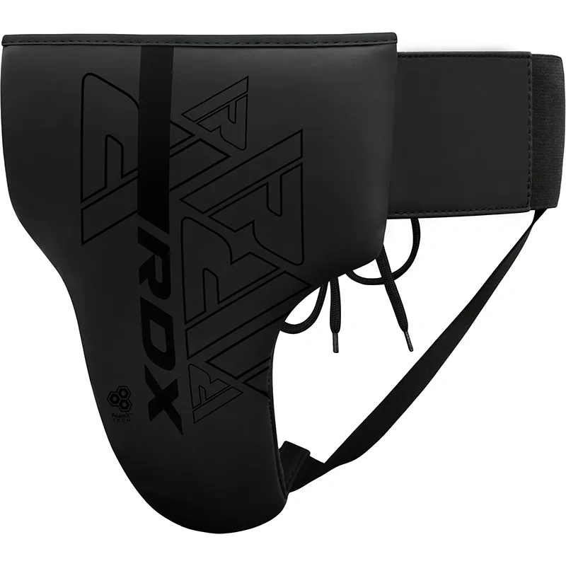 Black groin guard with RDX logo, molded front cup, lace ties and wide elastic waist strap.