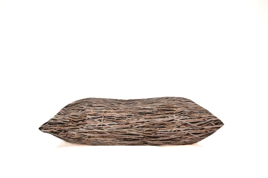 Flattened cushion in side view with 100% polyester cover in brown twig nature print.