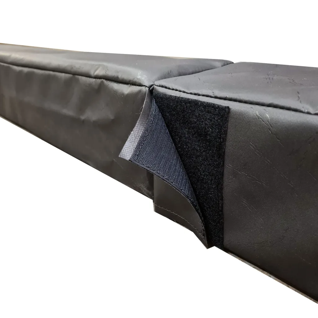 Black foam pitch divider section with heavy-duty PVC cover and exposed hook-and-loop connector at the joined seam.