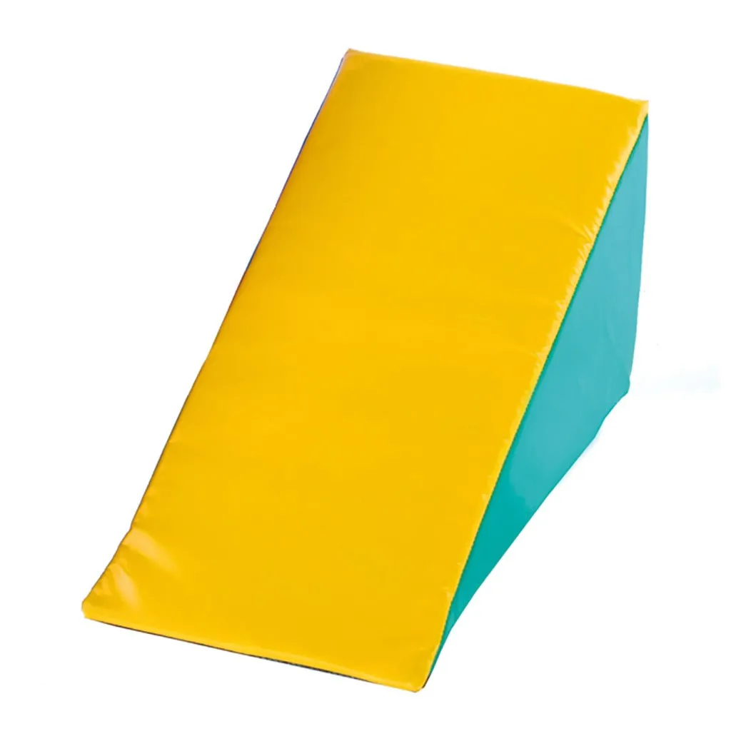 Yellow inclined soft-play foam wedge with a teal side cover and smooth vinyl surface used as a children's play ramp.