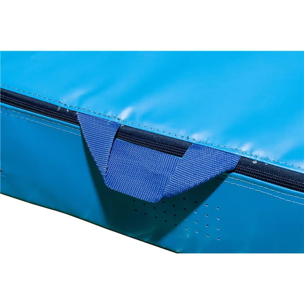 Blue uneven bars landing mat corner with stitched seam, black zipper and blue webbing carry handle.