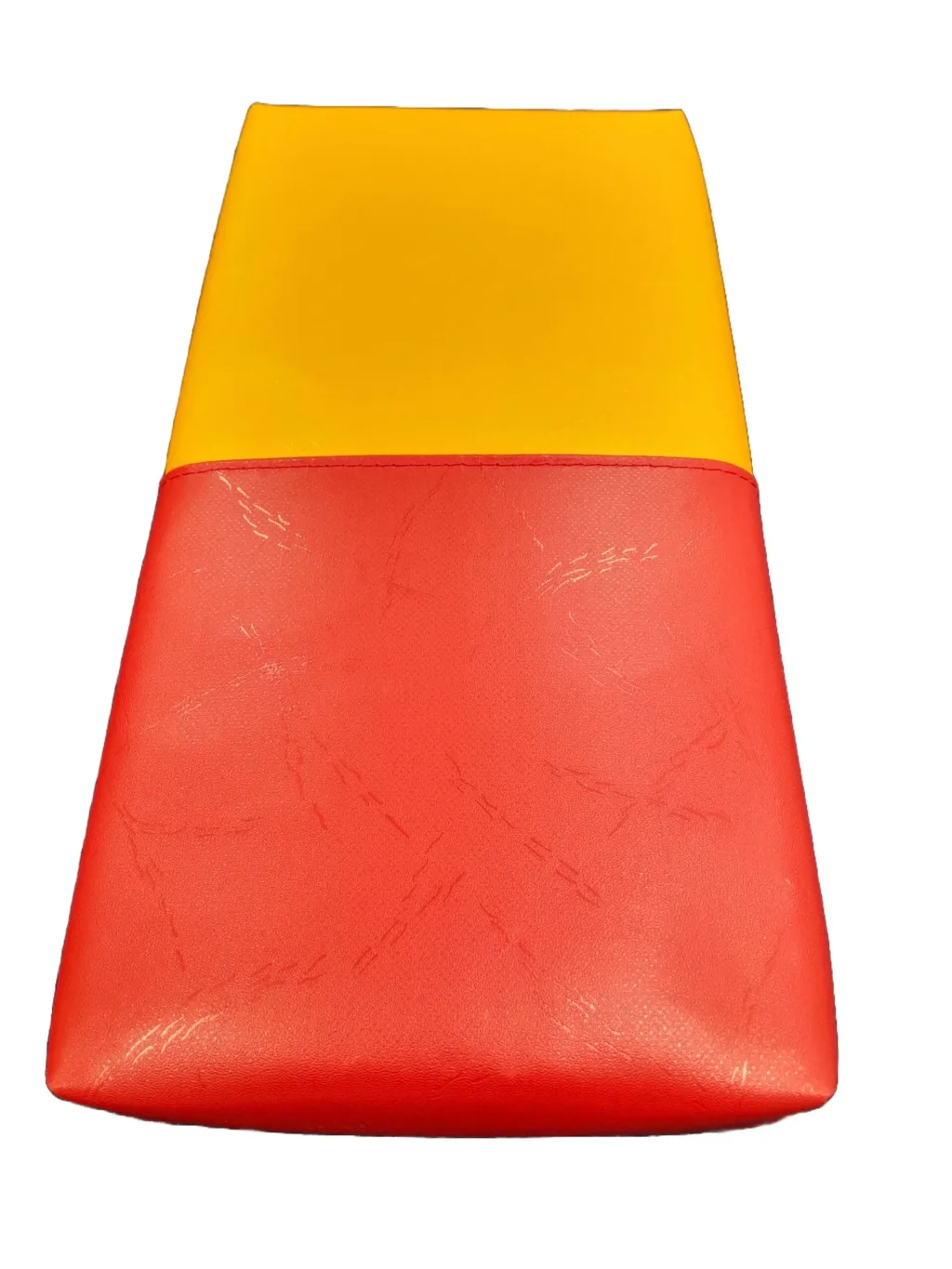 Foam domino piece with a yellow top and red bottom separated by a stitched seam.