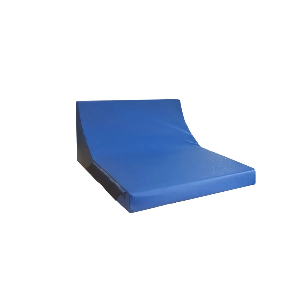 Top tumbler wedge with sloped top and side carry handles, covered in heavy-duty flame-retardant PVC over high-density PU foam on a white background.