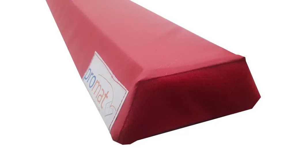 Red foam balance beam with heavy-duty flame-retardant PVC cover and high-density PE foam core, label reading promat.