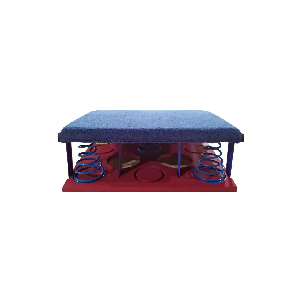 Blue carpeted springboard with padded top glued to elastic rubber foam and held by five conical springs above a rectangular base.