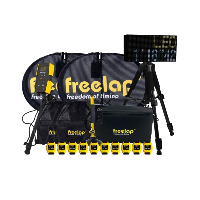 Motocross timing kit with 'freelap freedom of timing' logo, yellow-black transponders, tripods, carry bag and LED display.